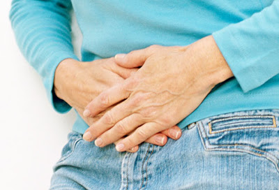 getty_rf_photo_of_hands_on_stomach.jpg