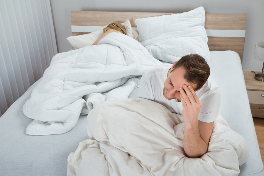 bigstock-Depressed-Man-On-Bed-While-Wom-90039428.jpg