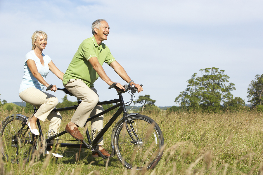 bigstock-Mature-couple-riding-tandem-13905152.jpg