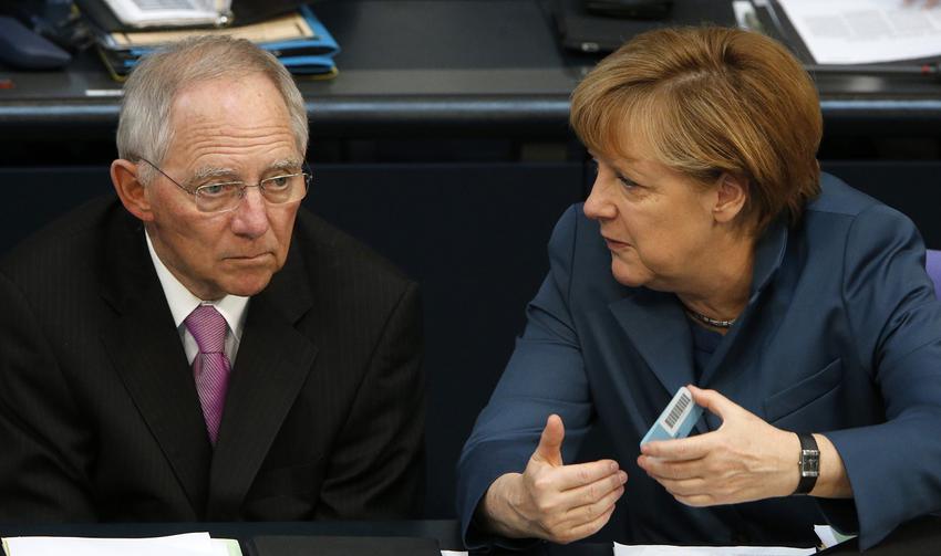 German Chancellor Merkel talks to  Finance Minister Schaueble during a session of the lower house of parliament Bundestag in Berlin