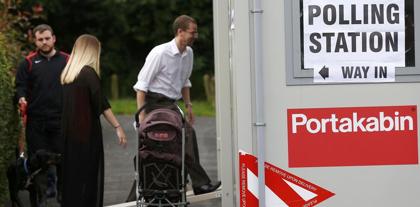 People arrive to vote at a polling station for the Referendum on the European Union in Heald Green, Stockpor