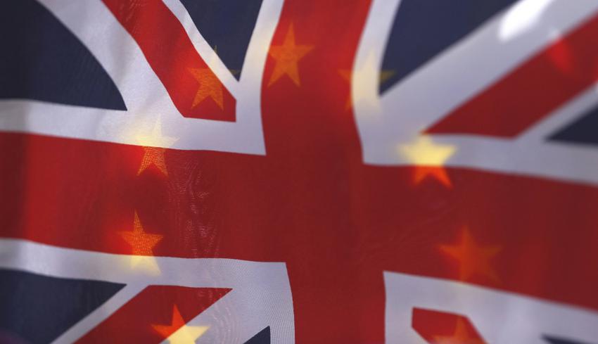 An EU flag is seen through a British Union flag during a pro-EU referendum event at Parliament Square in London