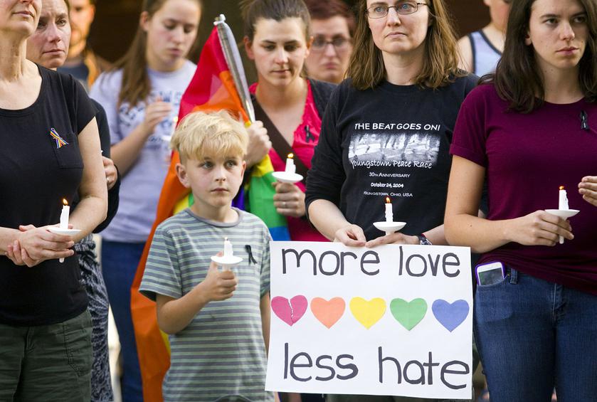 Community members gather for a candle light vigil to honor the victims of the attack on a nightclub in Orlando, Fla., on Sunday, June 12, 2016, at Friendship Square in Moscow, Idaho. More than 150 people attended the vigil.  (Geoff Crimmins/Moscow-Pullman Daily News via the AP)