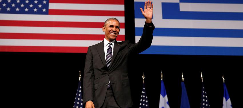 U.S. President Barack Obama acknowledges applause after delivering a speech at the Stavros Niarchos Foundation Cultural Center in Athens