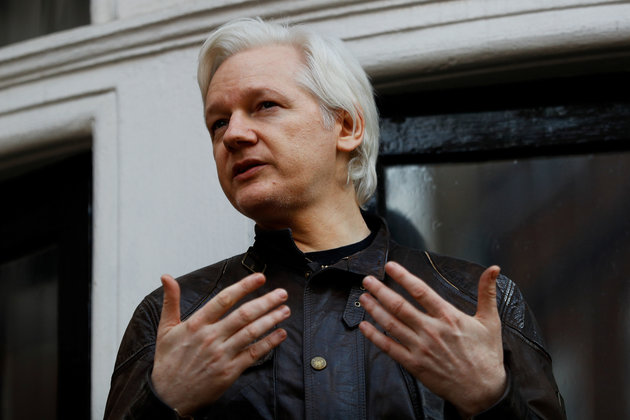 WikiLeaks founder Julian Assange is seen on the balcony of the Ecuadorian Embassy in London