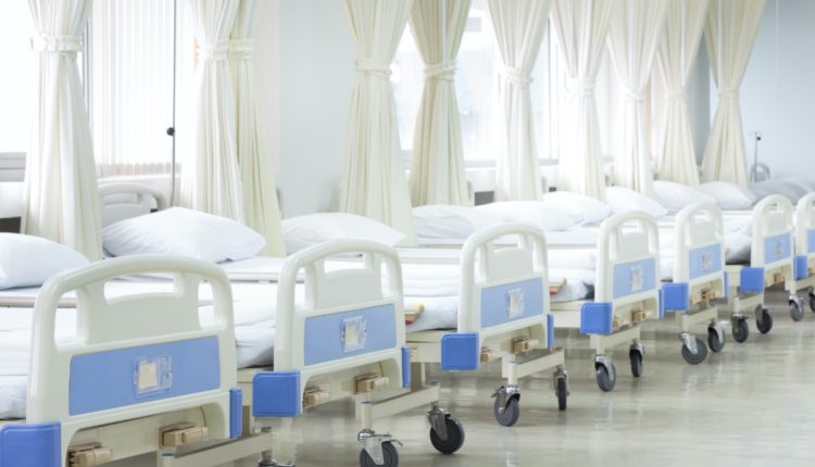Hospital ward with beds and medical equipment, interior of new empty hospital room.