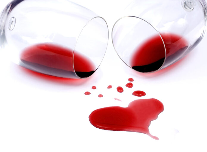 Red,Wine,Spilled,From,Glasses,Forming,Heart,Shape