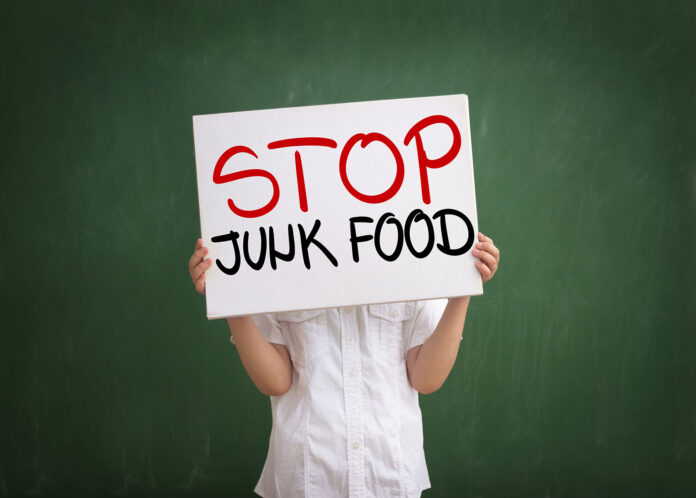 Boy,Holding,A,Sign,With,No,Junk,Food,Text