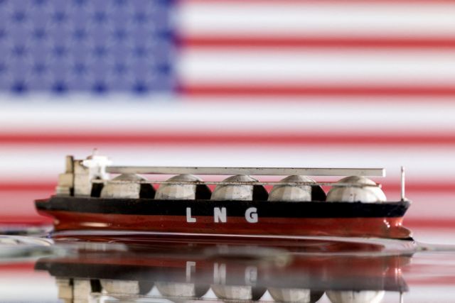 FILE PHOTO: Illustration shows model of LNG tanker and the U.S. flag