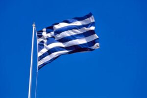 Waving flag of Greece with a clear blue sky
