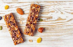 healthy-delicios-granola-bars-with-chocolate-muesli-bars-with-nuts-dry-fruits-top-view_114579-10187